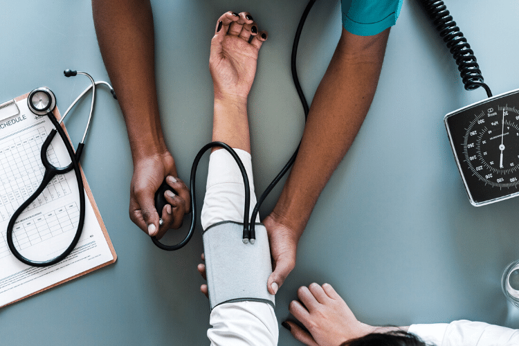 woman's arm with blood pressure pump