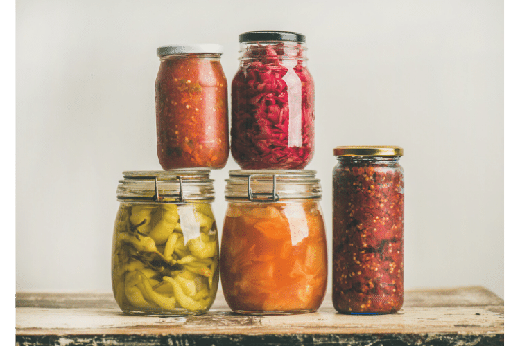 jars containing colorful fermented foods